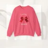 Feminine & Flirty sweatshirt with red satin bow design on Gildan 18000 - Safety Pink Flatlay