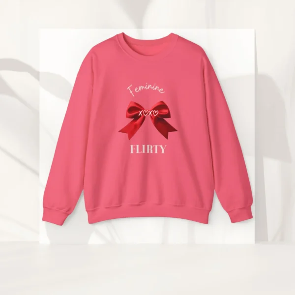 Feminine & Flirty sweatshirt with red satin bow design on Gildan 18000 - Safety Pink Flatlay