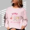 Flirt Like a French Girl sweatshirt with Eiffel Tower and macron design on Gildan 18000 - Light Pink