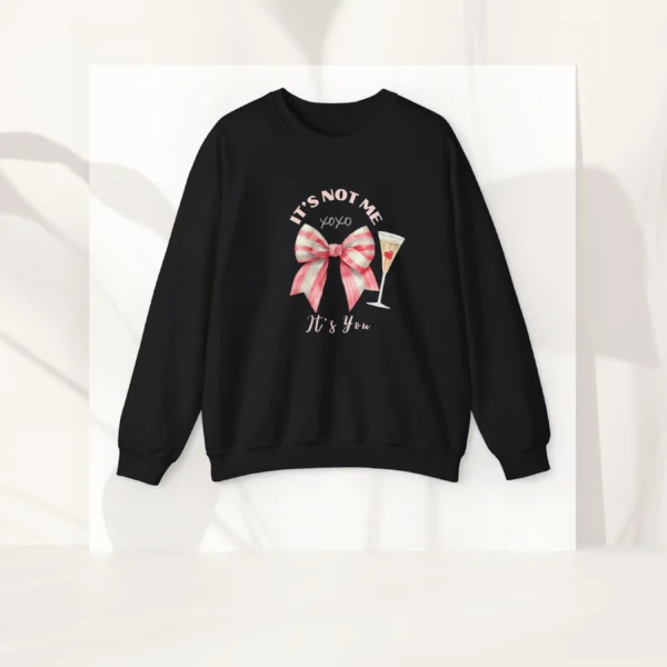 It’s Not Me It’s You sweatshirt with bow and champagne glass design on Gildan 18000 crewneck - Black Flatlay