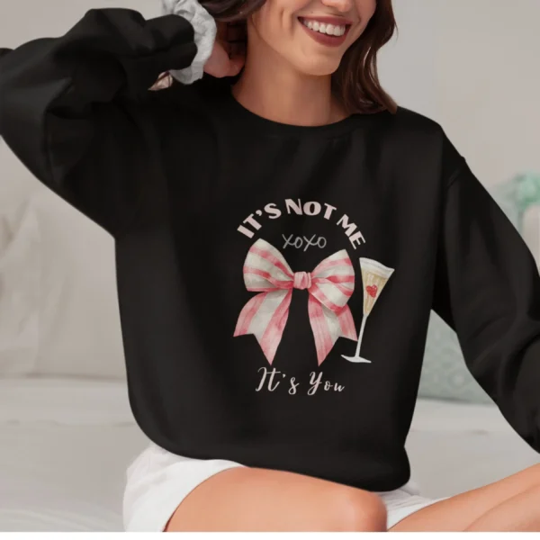 It’s Not Me It’s You sweatshirt with bow and champagne glass design on Gildan 18000 crewneck - Black