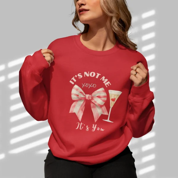 It’s Not Me It’s You sweatshirt with bow and champagne glass design on Gildan 18000 crewneck - Cherry Red