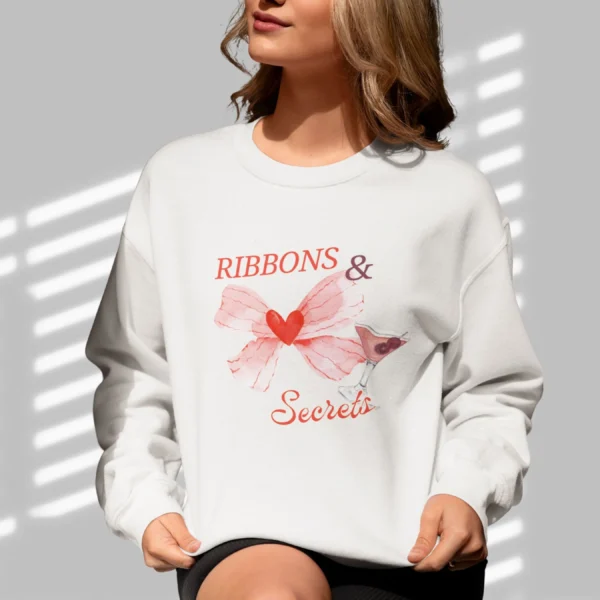 Ribbons & Secrets sweatshirt with a pink bow and cocktail design on Gildan 18000 - Ash
