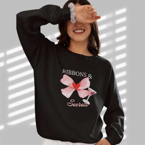 Ribbons & Secrets sweatshirt with a pink bow and cocktail design on Gildan 18000 - Black