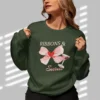 Ribbons & Secrets sweatshirt with a pink bow and cocktail design on Gildan 18000 - Forest Green