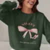 Sweet But Never Subtle bow sweatshirt with pink bow and heels Gildan 18000 crewneck - Forest Green