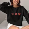 Three Hearts sweatshirt with red hearts design on Gildan 18000 - Black
