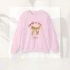 Tied with grace sweatshirt with bow and lipstick design on Gildan 18000 - Light Pink Flatlay