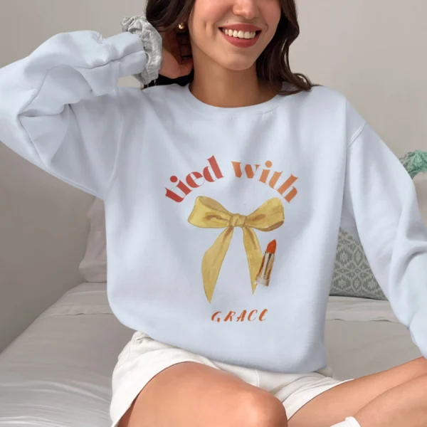 Tied with grace sweatshirt with bow and lipstick design on Gildan 18000 - Light Blue