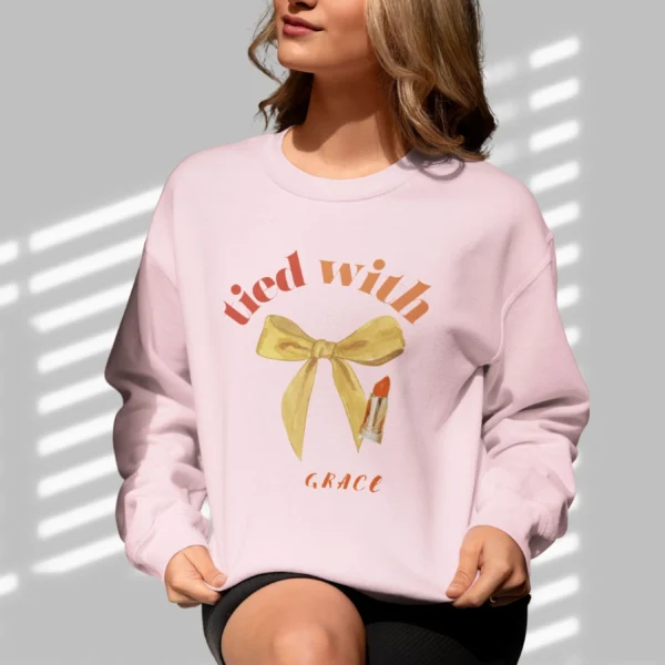 Tied with grace sweatshirt with bow and lipstick design on Gildan 18000 - Light Pink
