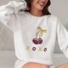 XOXO Cherry sweatshirt with cherry and bow design on Gildan 18000 - White