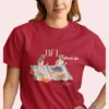 BFF Mode On Tee with watercolor illustration of two girls enjoying a picnic with fruit, waffles, a basket & drinks on striped blanket on Comfort Colors 1717 - Red