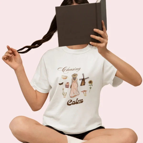 Chasing Calm Tee with cottage girl, geese, florals, and windmill on Comfort Colors 1717 - White