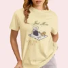 Just Here for the Cozy Tee 1717 with illustration of a girl enjoying picnic on Comfort Colors 1717 - Banana