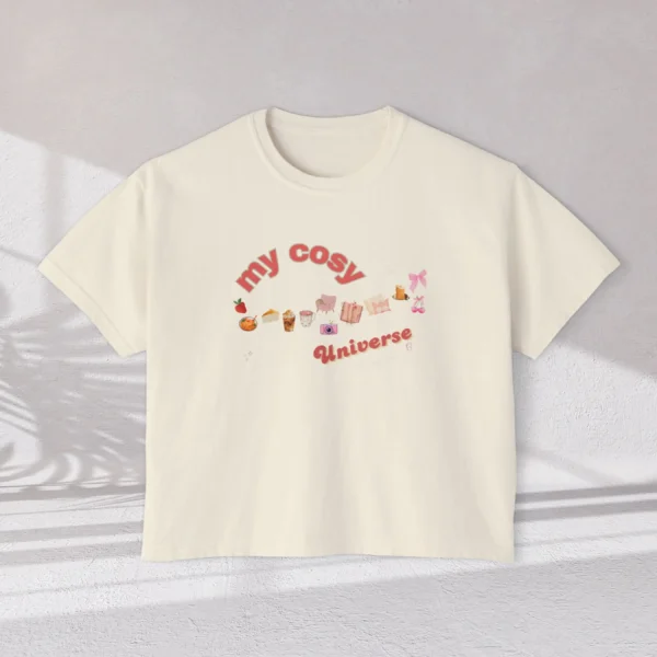 My Cozy Universe Tee with books, candle, couch, bow design on CC3023 - Ivory Flatlay