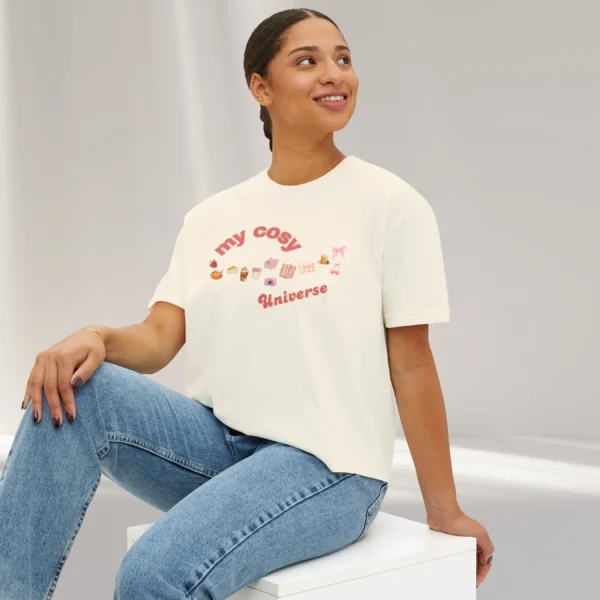 My Cozy Universe Tee with books, candle, couch, bow design on CC3023 - Ivory Sitting