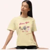 Graphic T-shirt with "Retro Girl" text in pink, paired with disco ball, lipstick, purse, martini glass, and cassette on Comfort color 1717 - Banana