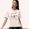 Graphic T-shirt with "Retro Girl" text in pink, paired with disco ball, lipstick, purse, martini glass, and cassette on Comfort color 1717 - Ivory