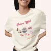 Graphic T-shirt with "Retro Girl" text in pink, paired with disco ball, lipstick, purse, martini glass, and cassette on Comfort color 1717 - Ivory Closeup