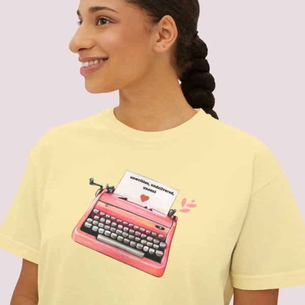 Letters of Love Tee with vintage red typewriter illustration on Comfort Colors 3023 - Butter Closeup
