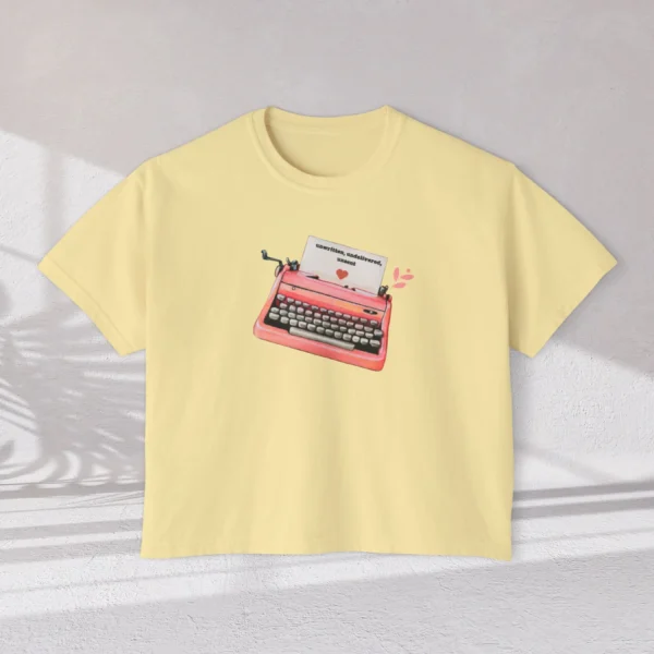 Letters of Love Tee with vintage red typewriter illustration on Comfort Colors 3023 - Butter Flatlay