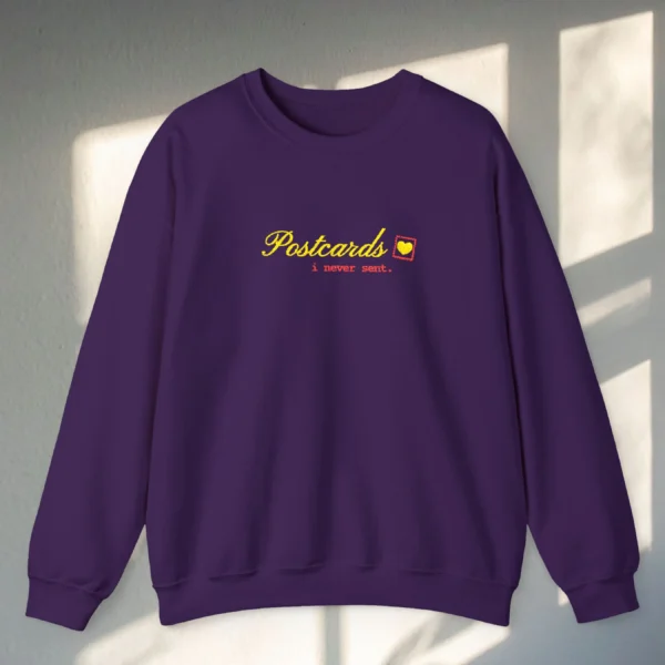 Postcards I Never Sent embroidered Gildan 18000 sweatshirt by Bhoomkins - Purple Flatlay