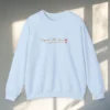 Signed, Still Yours embroidered Gildan 18000 sweatshirt by Bhoomkins - Light Blue Flatlay