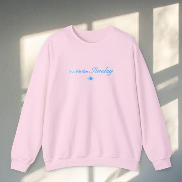 You Felt Like a Sunday embroidered Gildan 18000 sweatshirt by Bhoomkins - Light Pink Flatlay
