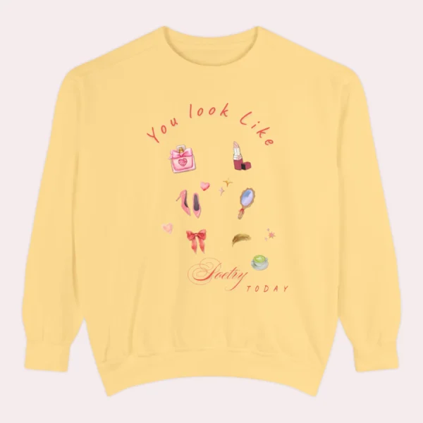 Sweatshirt with “You Look Like Poetry Today” quote and soft illustrated aesthetic elements like perfume, lipstick, ribbons, and hearts - Butter Flatlay