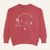 Sweatshirt with “You Look Like Poetry Today” quote and soft illustrated aesthetic elements like perfume, lipstick, ribbons, and hearts - Crimson Flatlay